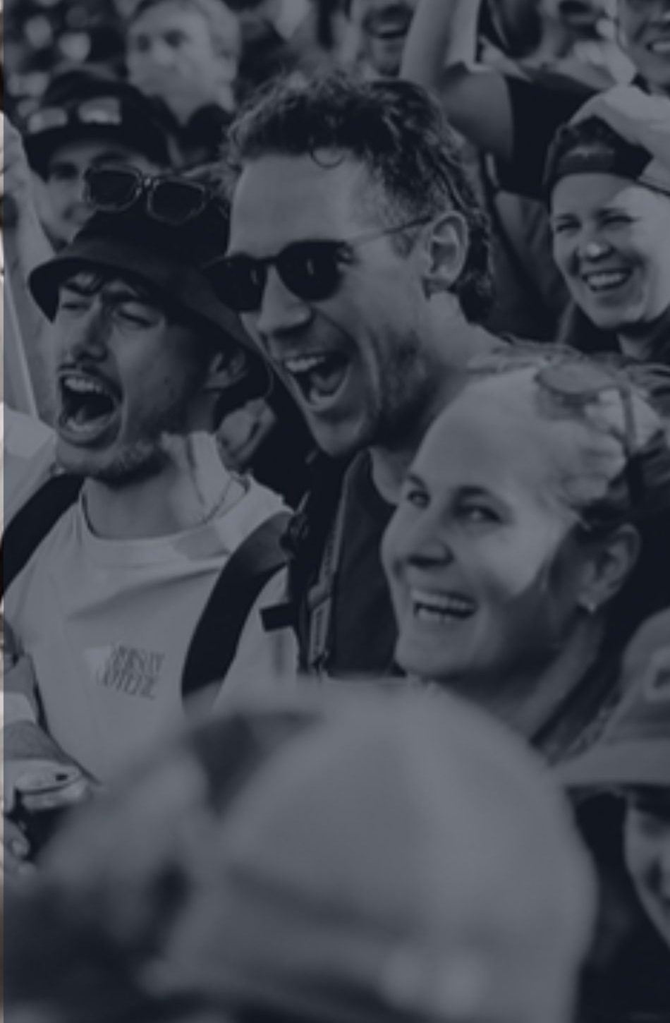 Fans cheering trackside at Mont-Sainte-Anne