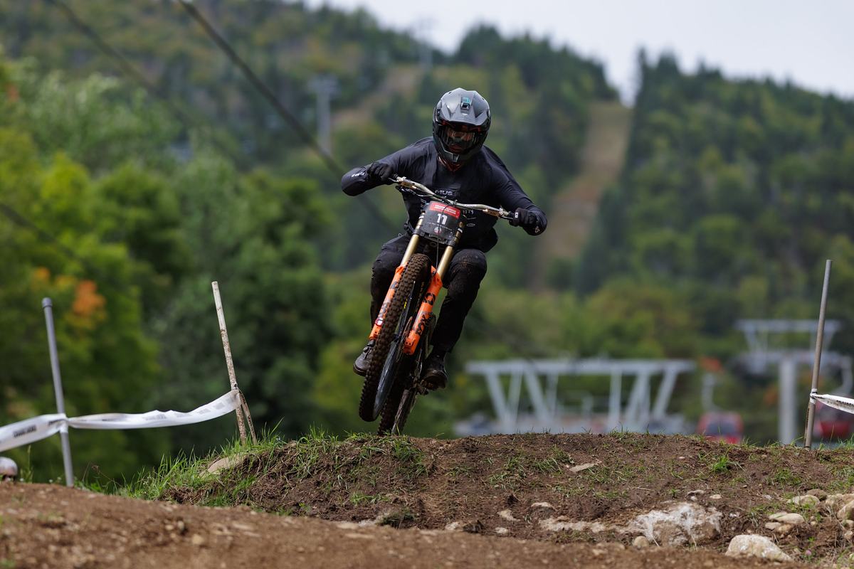 Downhill racer airs a jump at SilverStar